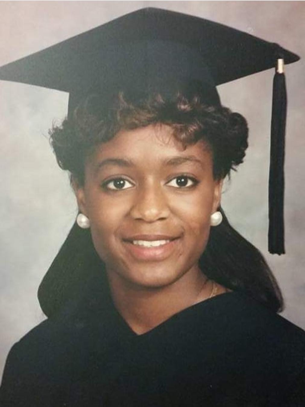 A photo of Karyn Holley wearing a cap and gown. 