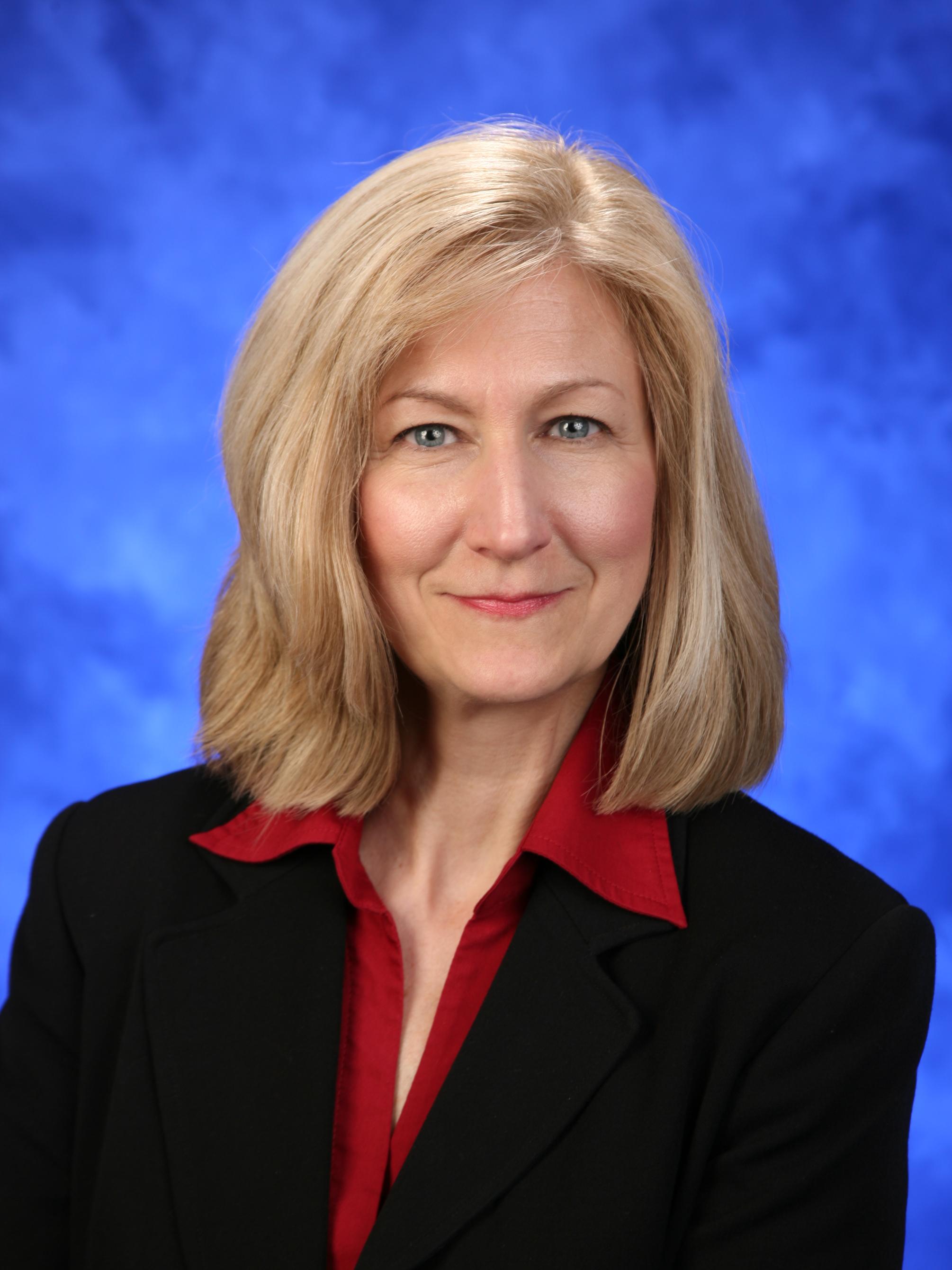 Mary Lou Kanaskie poses for a photo wearing professional attire.