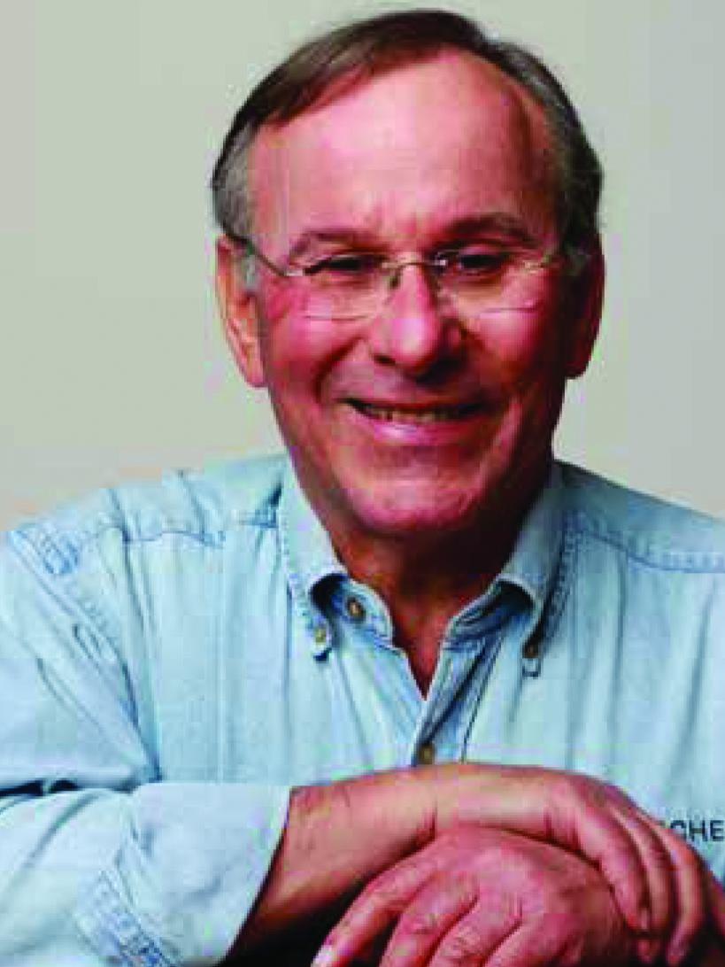 head shot of man with glasses