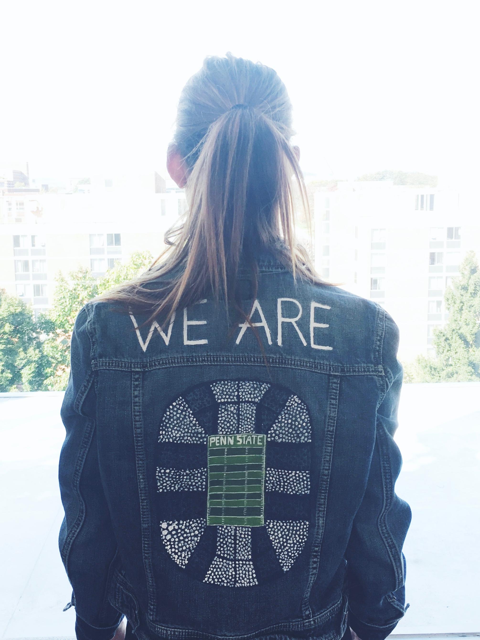 McKenna Kimmel wearing one of the Penn State jackets she created