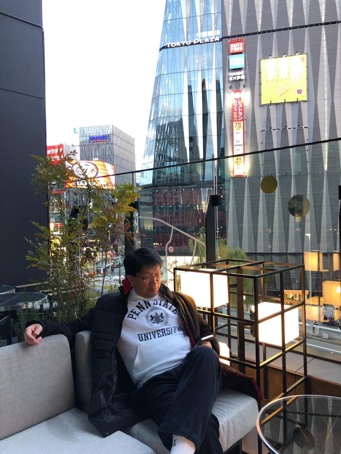 A man sitting on a couch outside