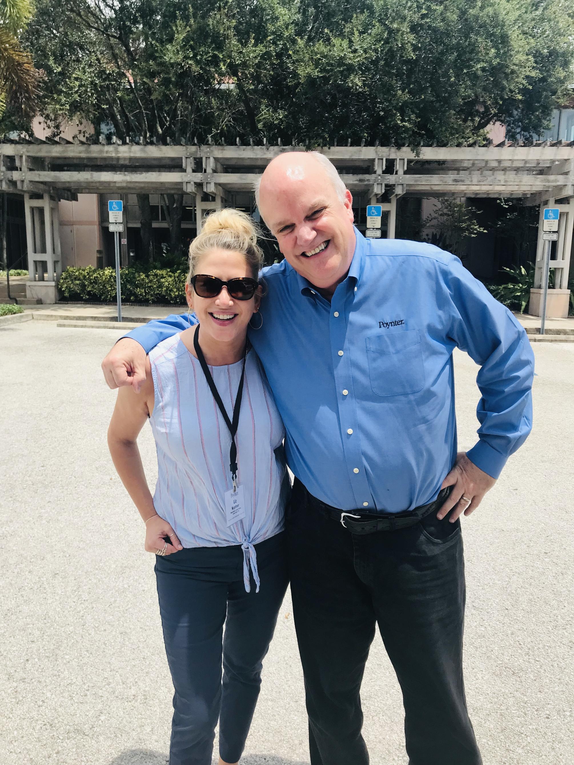 two people with arm around each other smiling