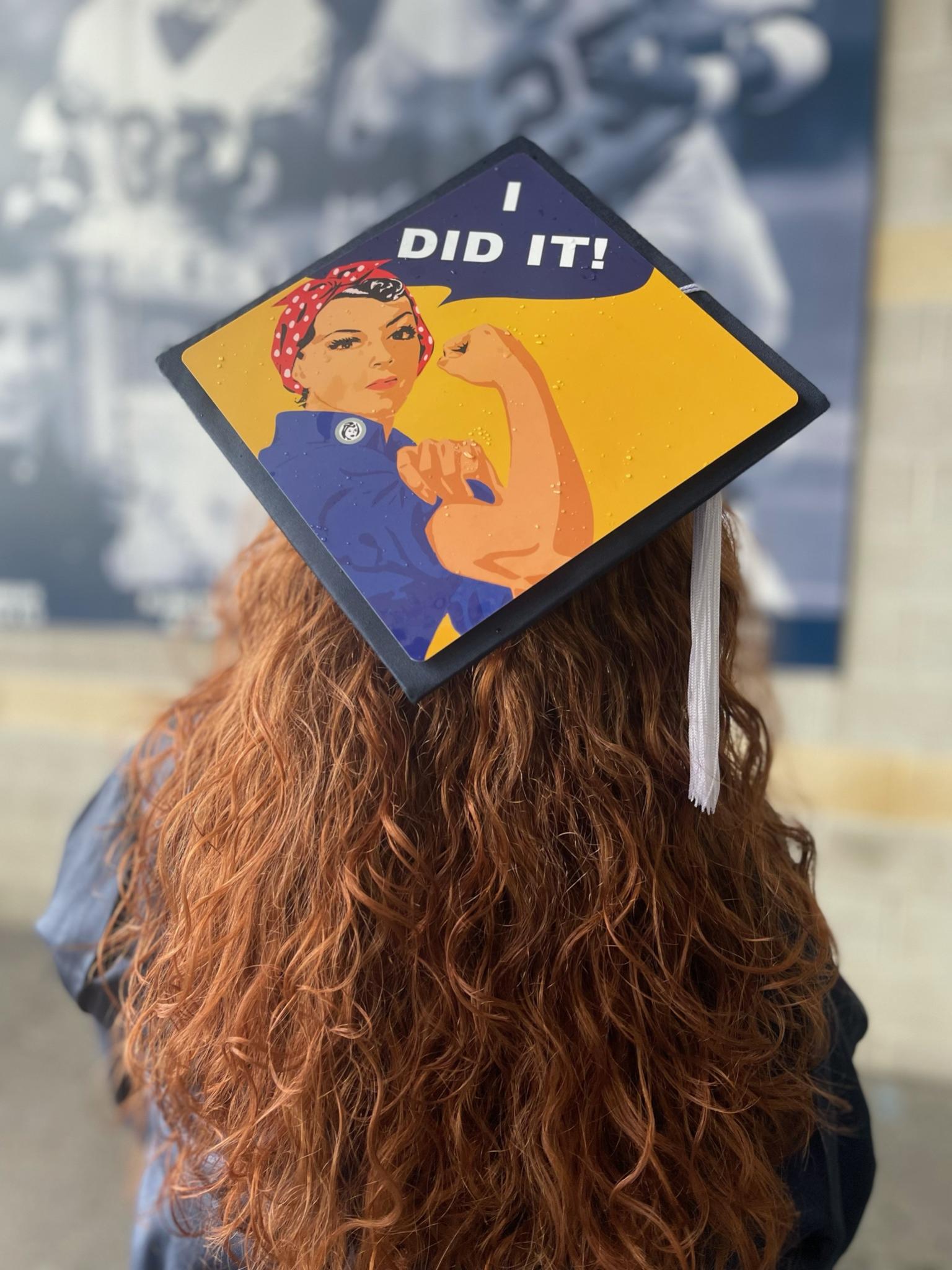 Rebecca Liebman wearing a graduation cap that reads "I Did It!"
