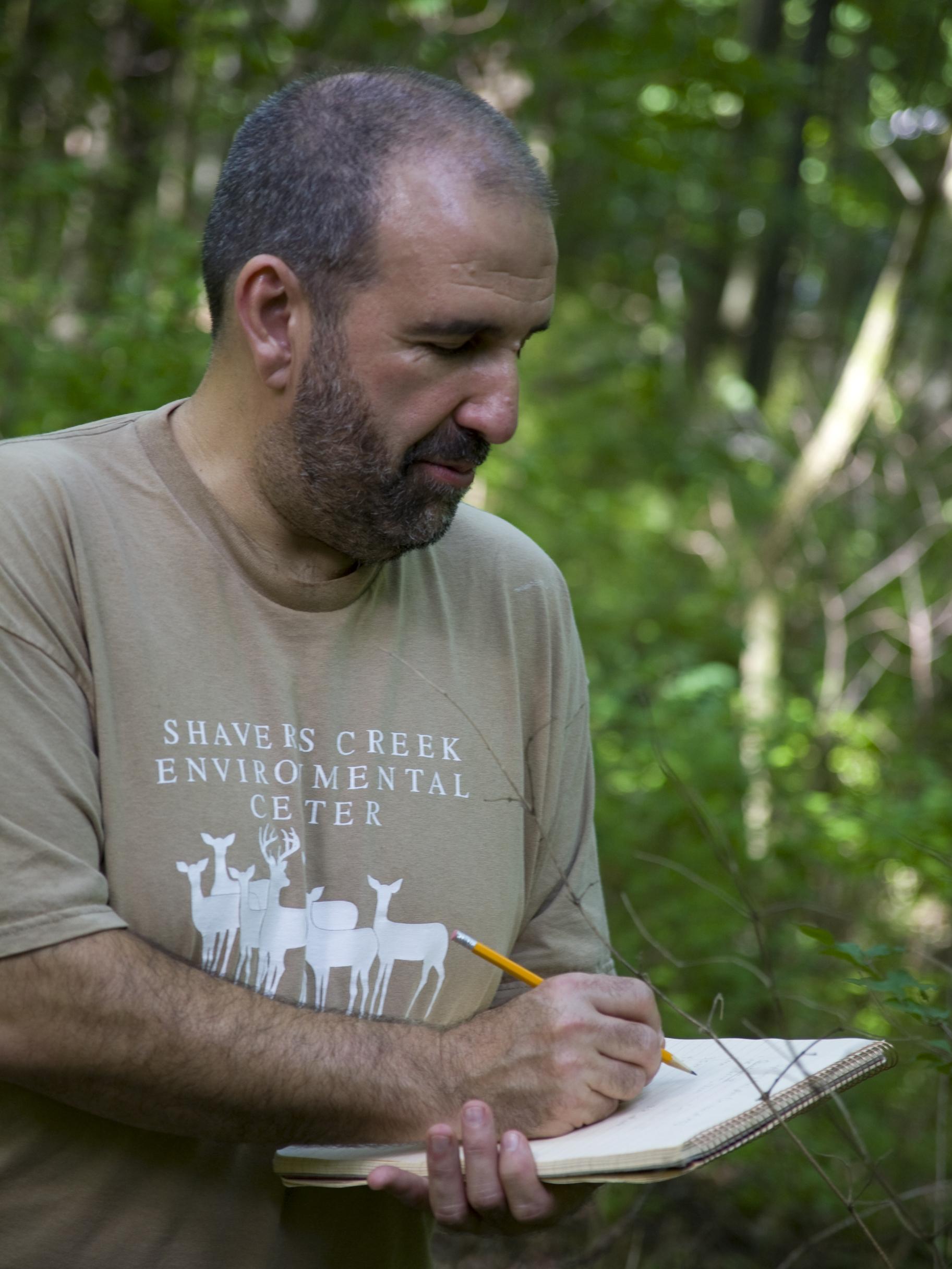 Associate Professor of Biology and Forestry Robert Loeb conducting fieldwork. 