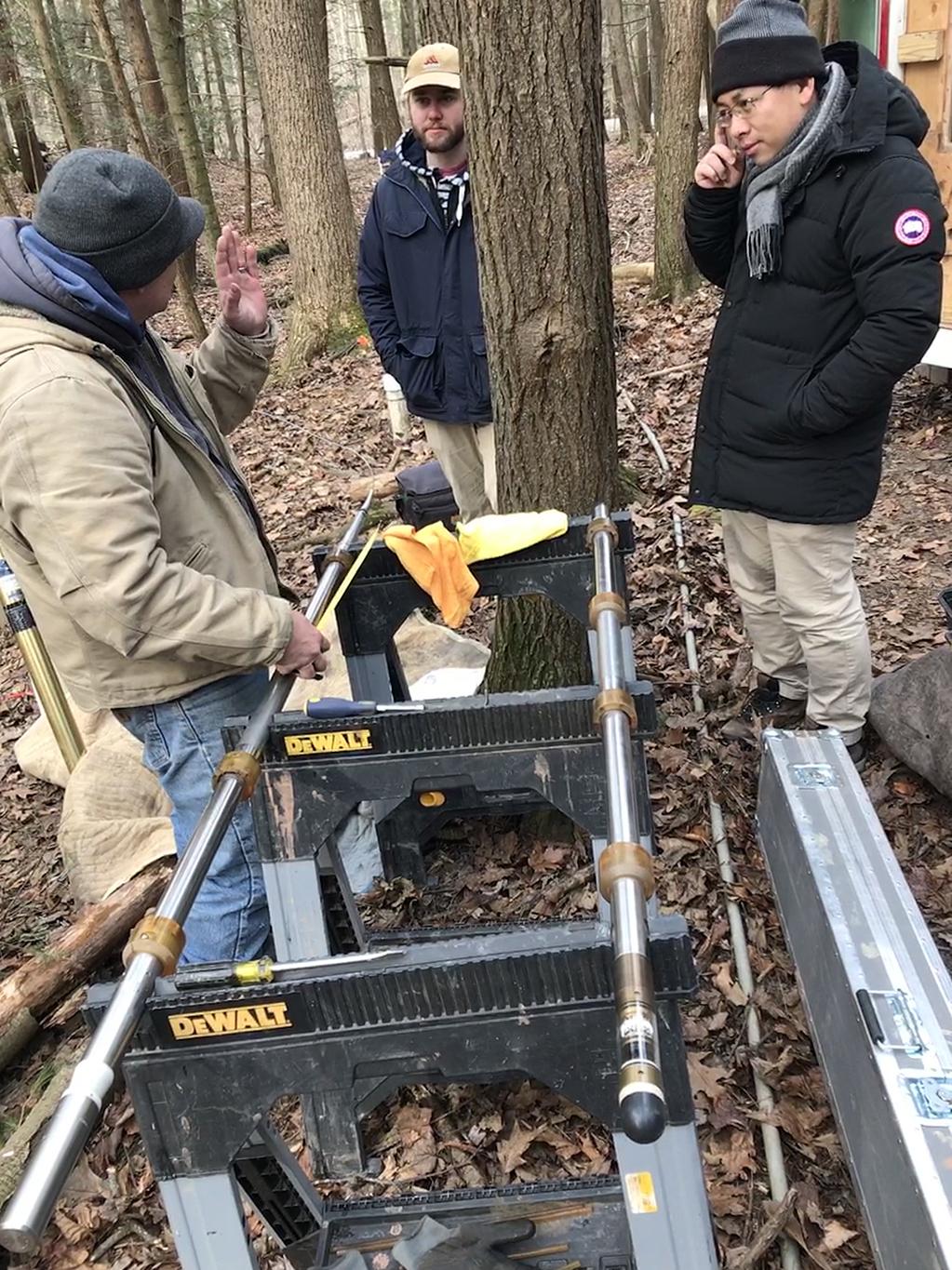 Researchers at the Shale Hills research site. Brad Carr, left, assembles tools to log a 115-foot deep borehole.