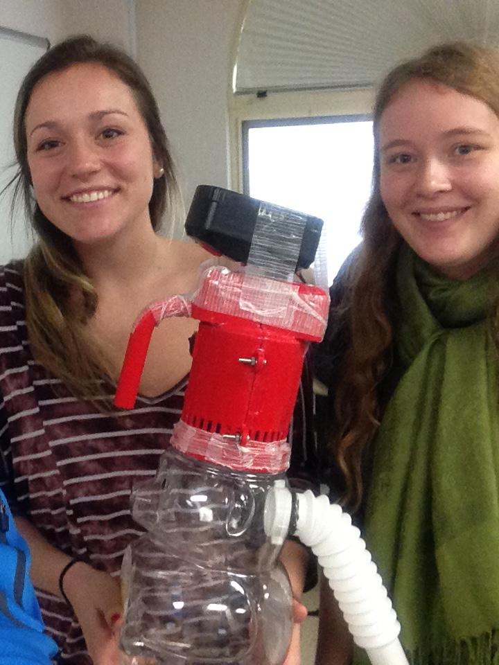 Students demonstrating a vacuum cleaner
