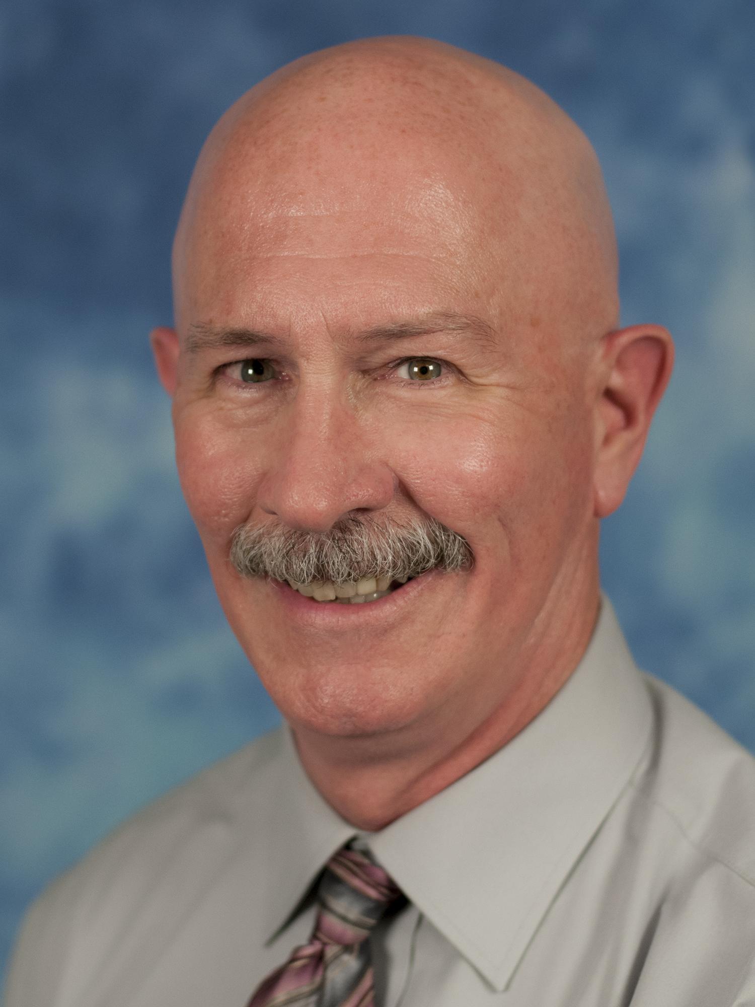 photo portrait of man in dress shirt and tie
