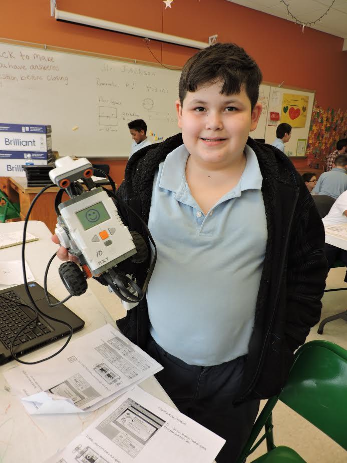 student holding robotic