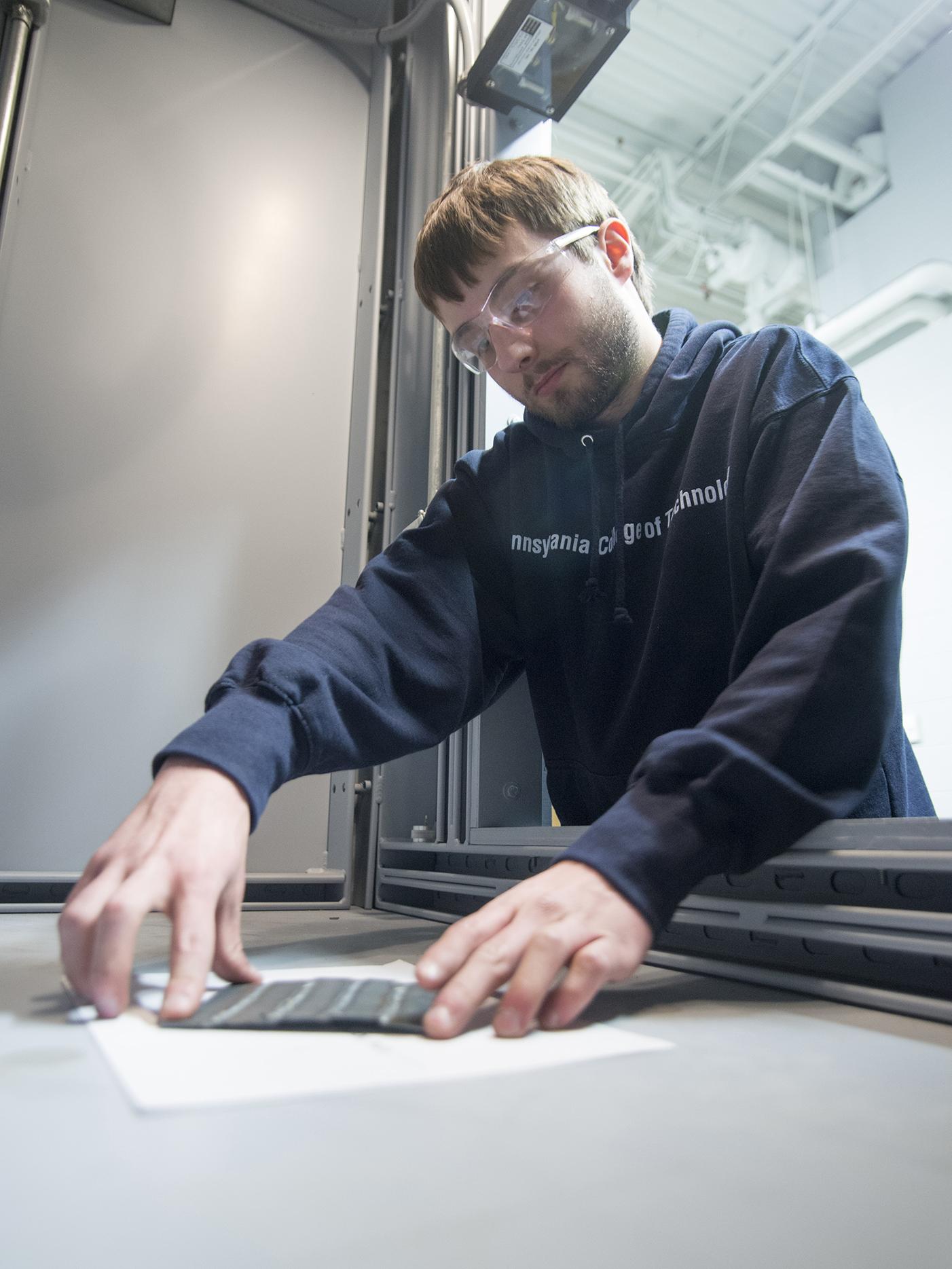 A Penn College student working on a project