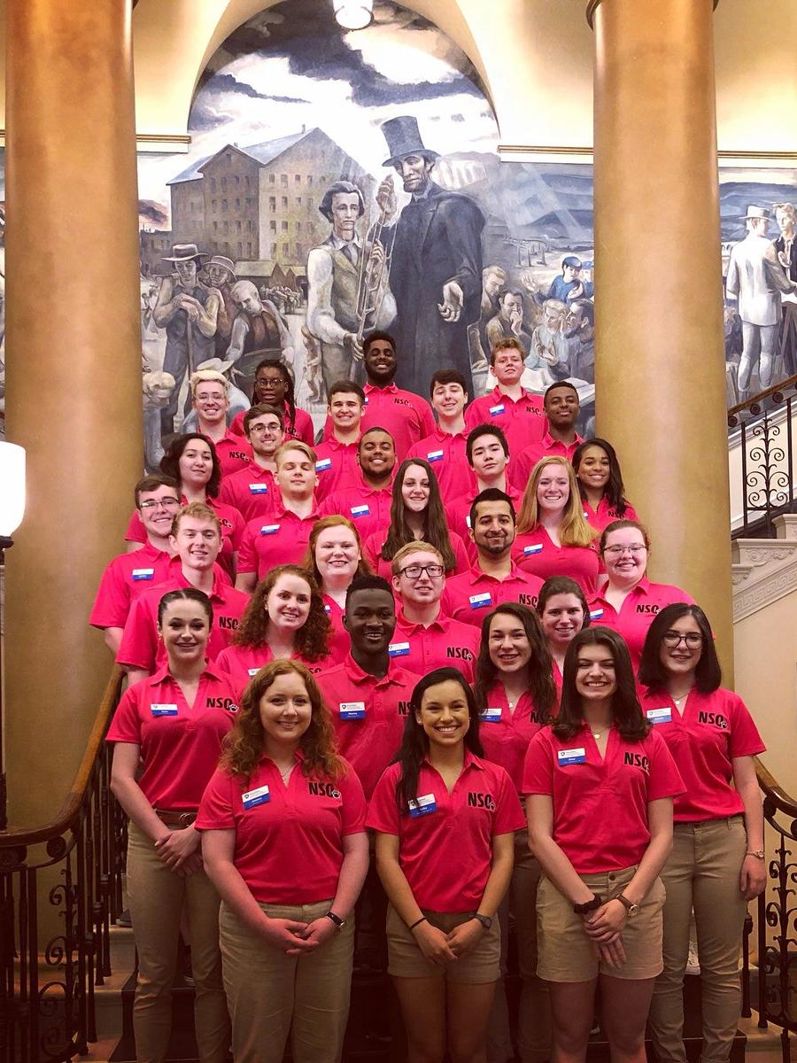 The orientation team poses for a photo inside Old Main