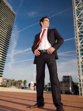 confident businessman, hands on hips