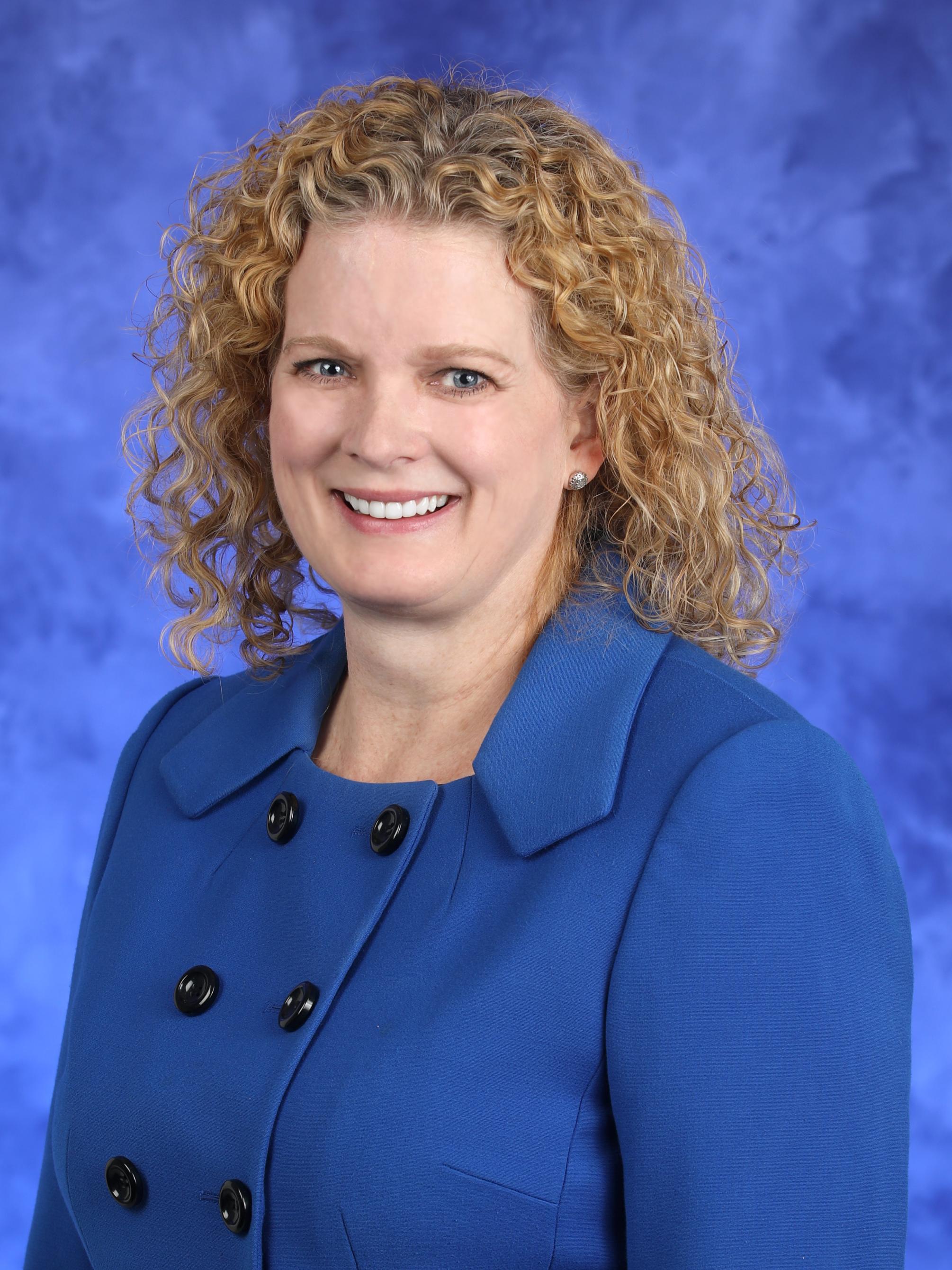 Julie Nickell poses for a professional headshot photo.