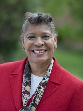 Patreese Ingram wearing a red jacket in a headshot photo