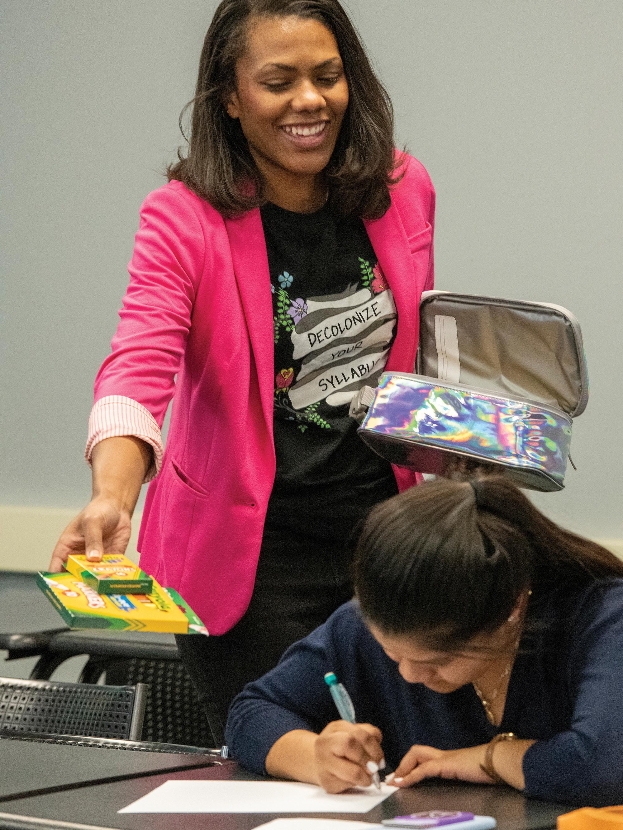 Ashley Patterson hands out materials in the D.C. Social Justice Fellowship course.