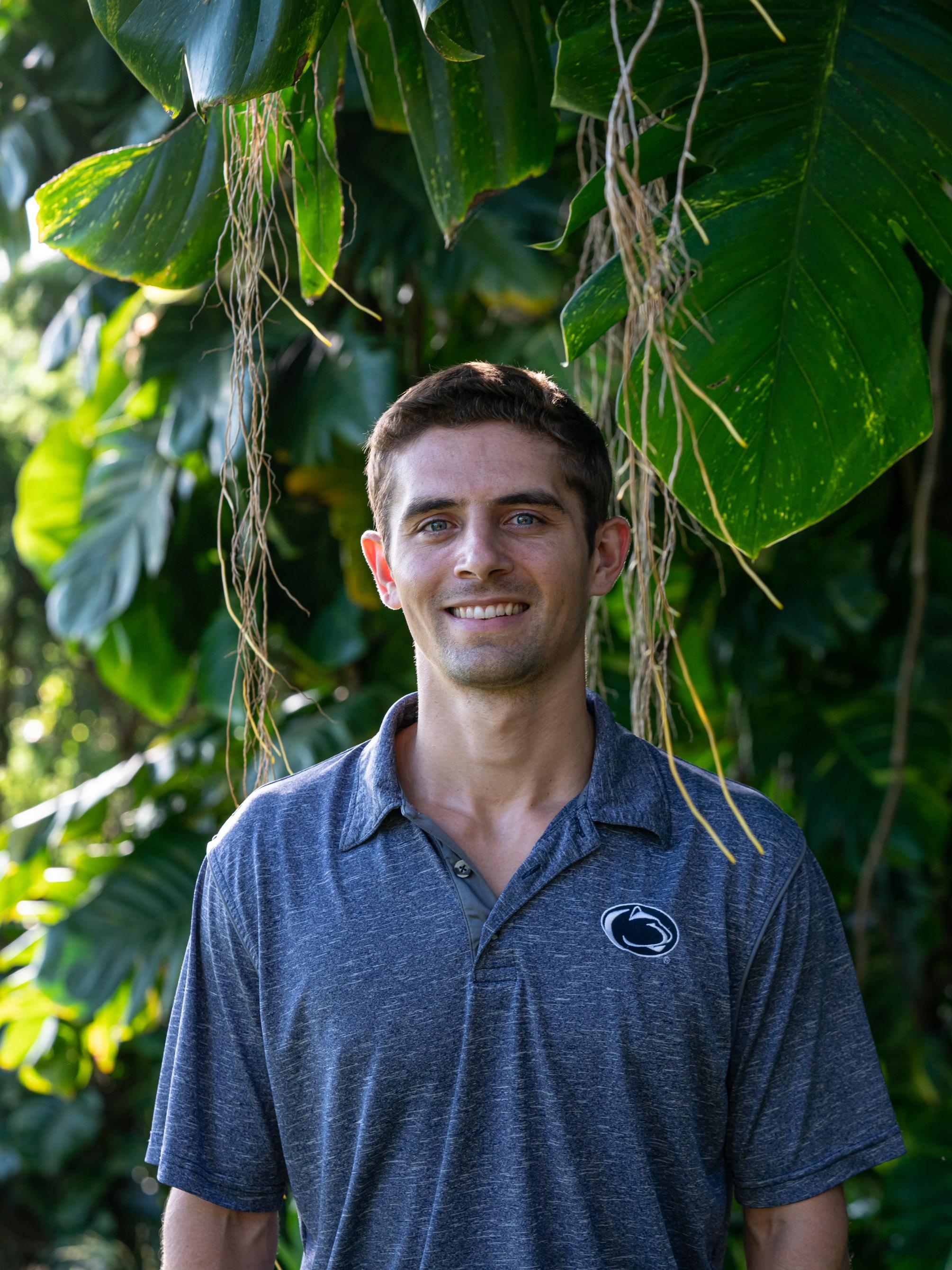 Paul Minninger standing in front of plants