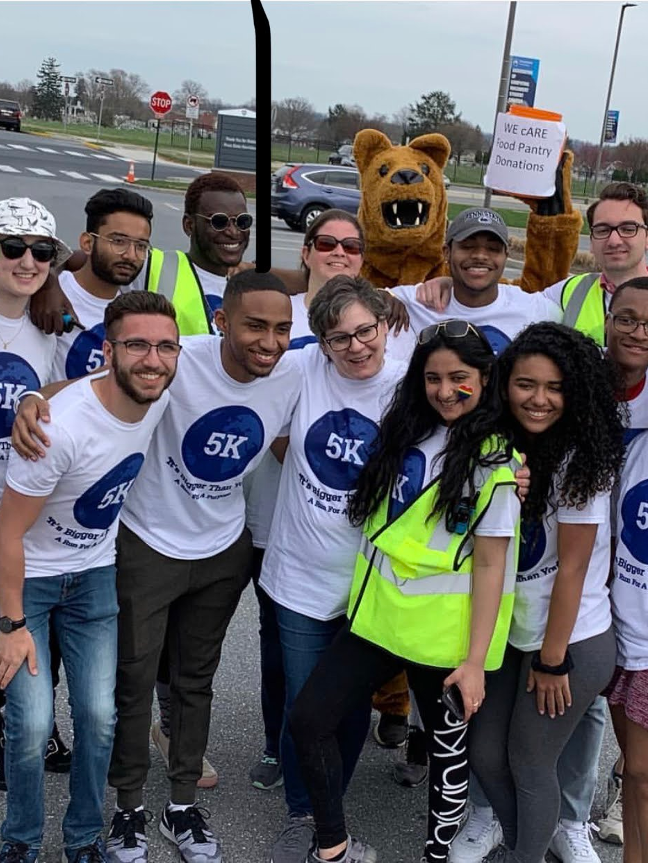 group of people with Nittany Lion