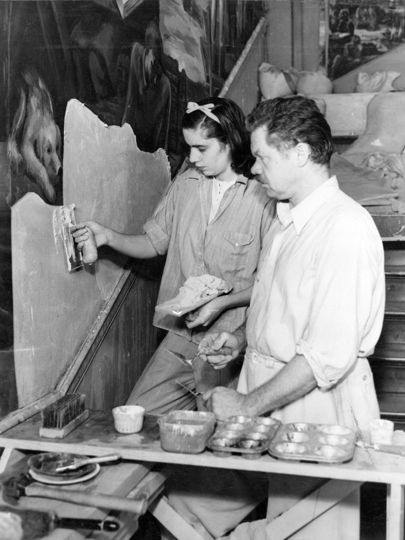 Poor and his daughter, Anne, working on the Land-Grant Frescoes