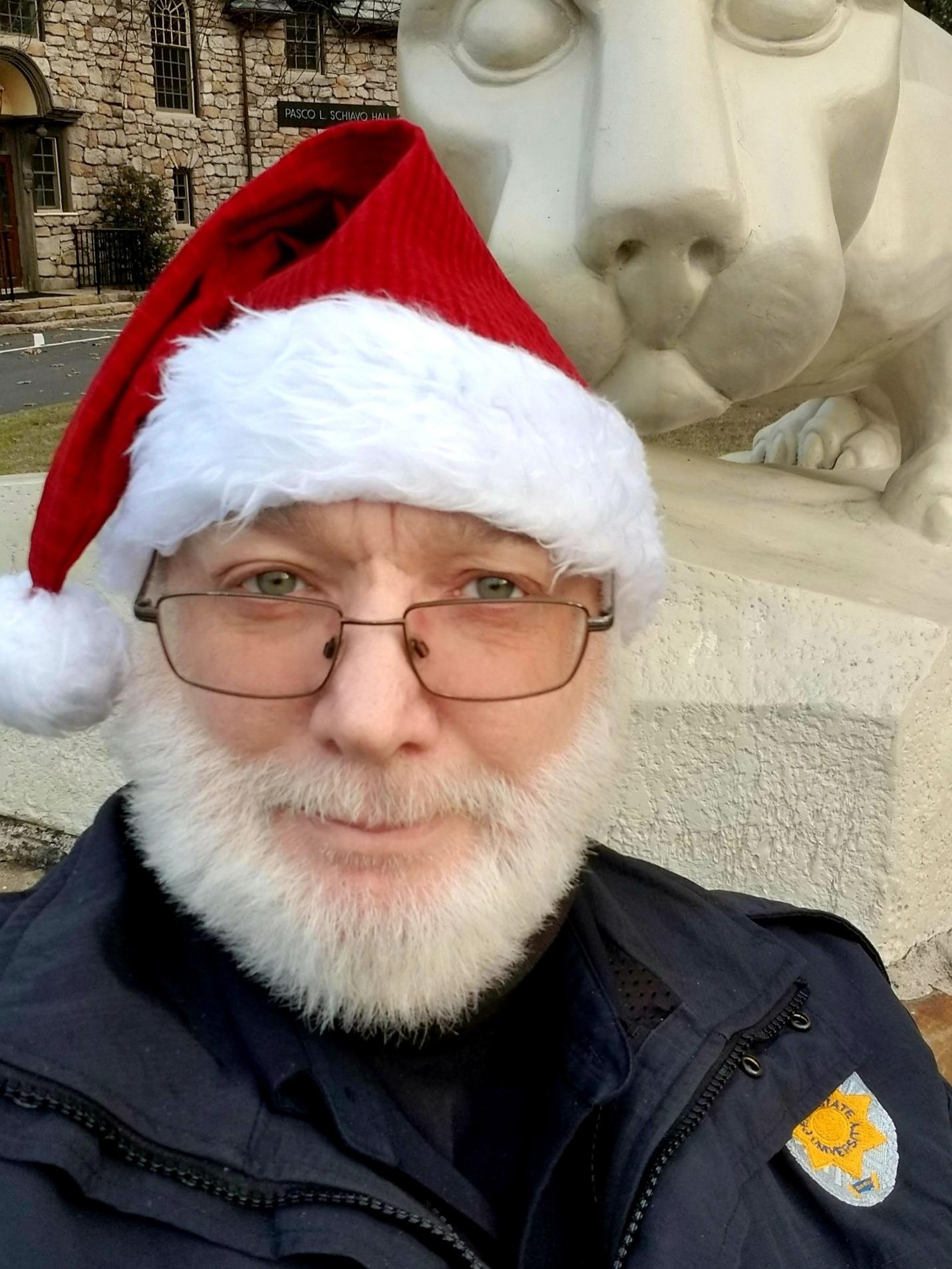 Officer Ralph Lindsey wearing a Santa hat