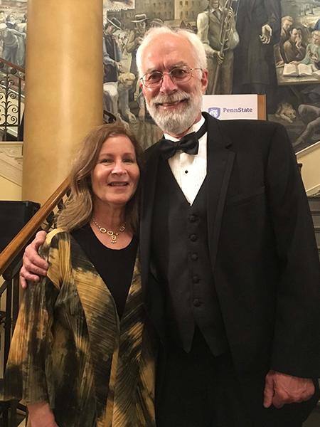 Rob and Anne Pangborn pose for a portrait inside Old Main