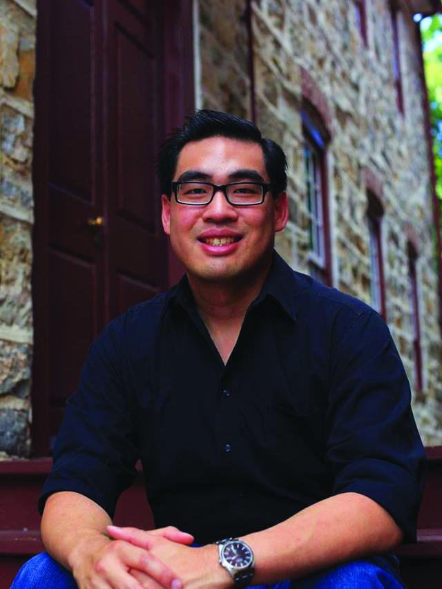 photo of man sitting on stoop