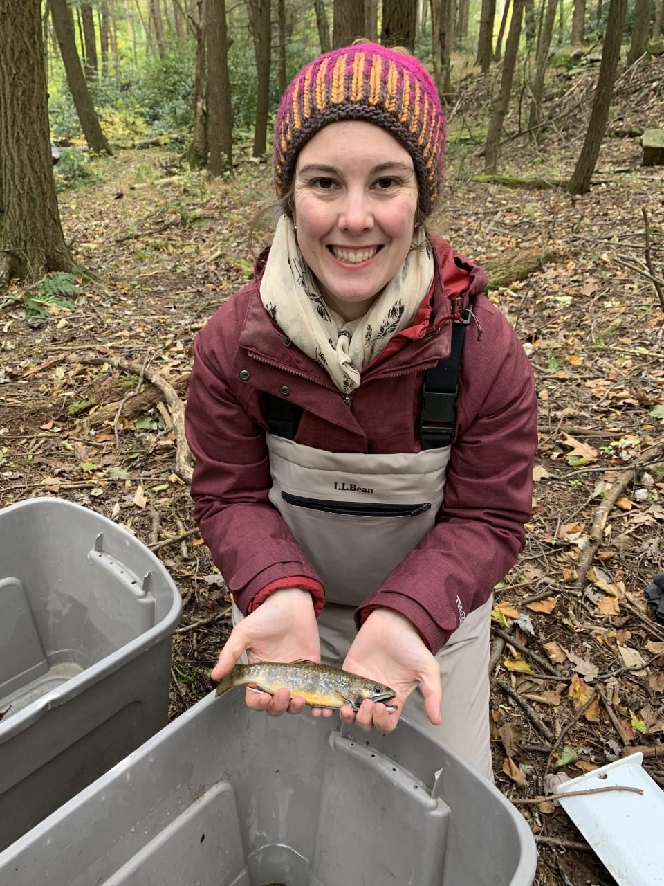 researcher with trout