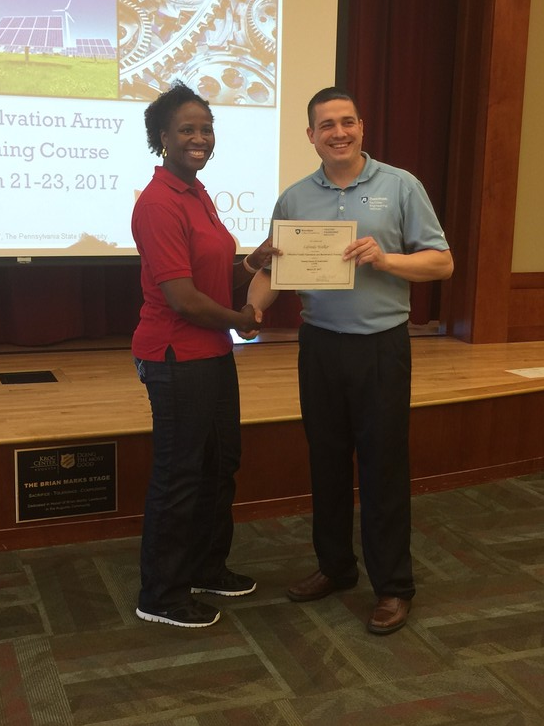 Man presenting a woman with a certificate