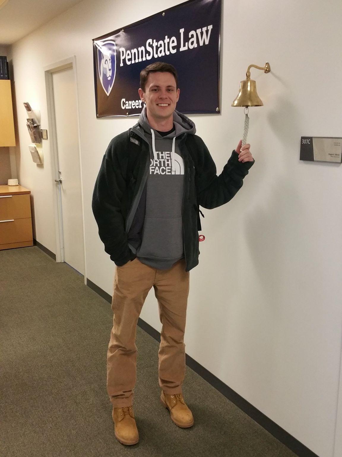 Tom Brier rings the Penn State Law Career Services bell