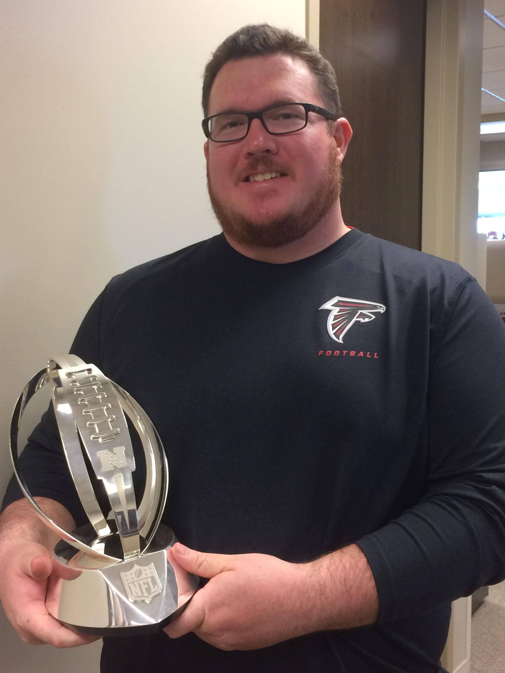 Turf Science alum Collin Meyers with NFC trophy