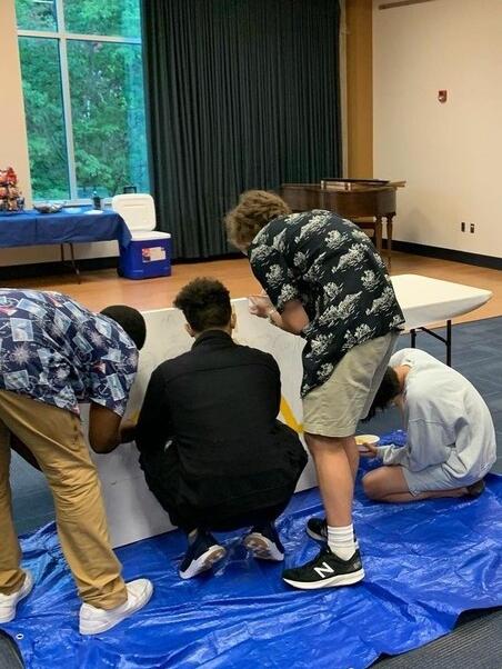 Students painting together
