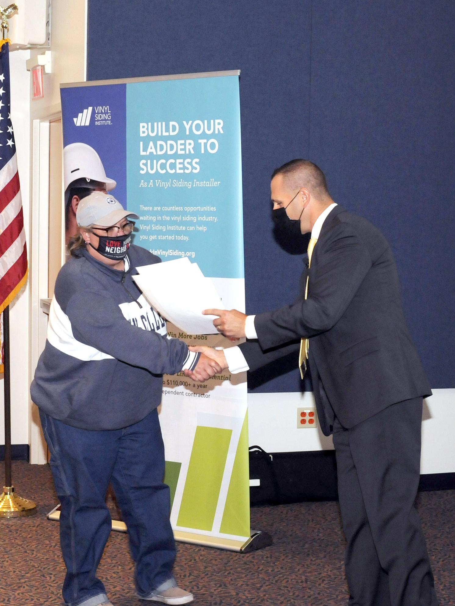 Vinyl siding student receives certificate