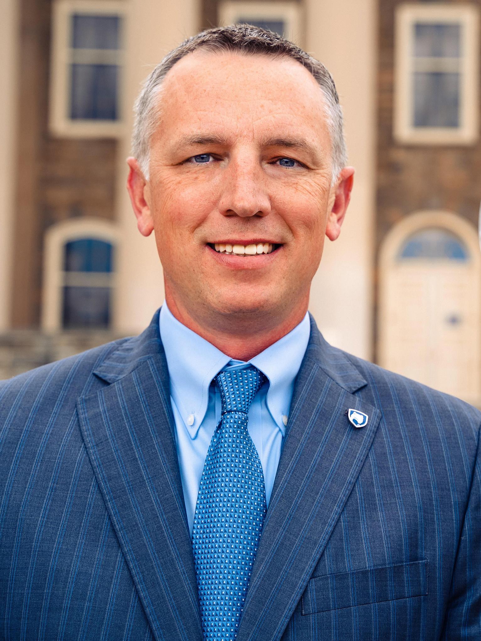 Headshot photo of Penn State Vice President for Government and Community Relations Zack Moore, taken outside of Old Main on Penn State's University Park campus.