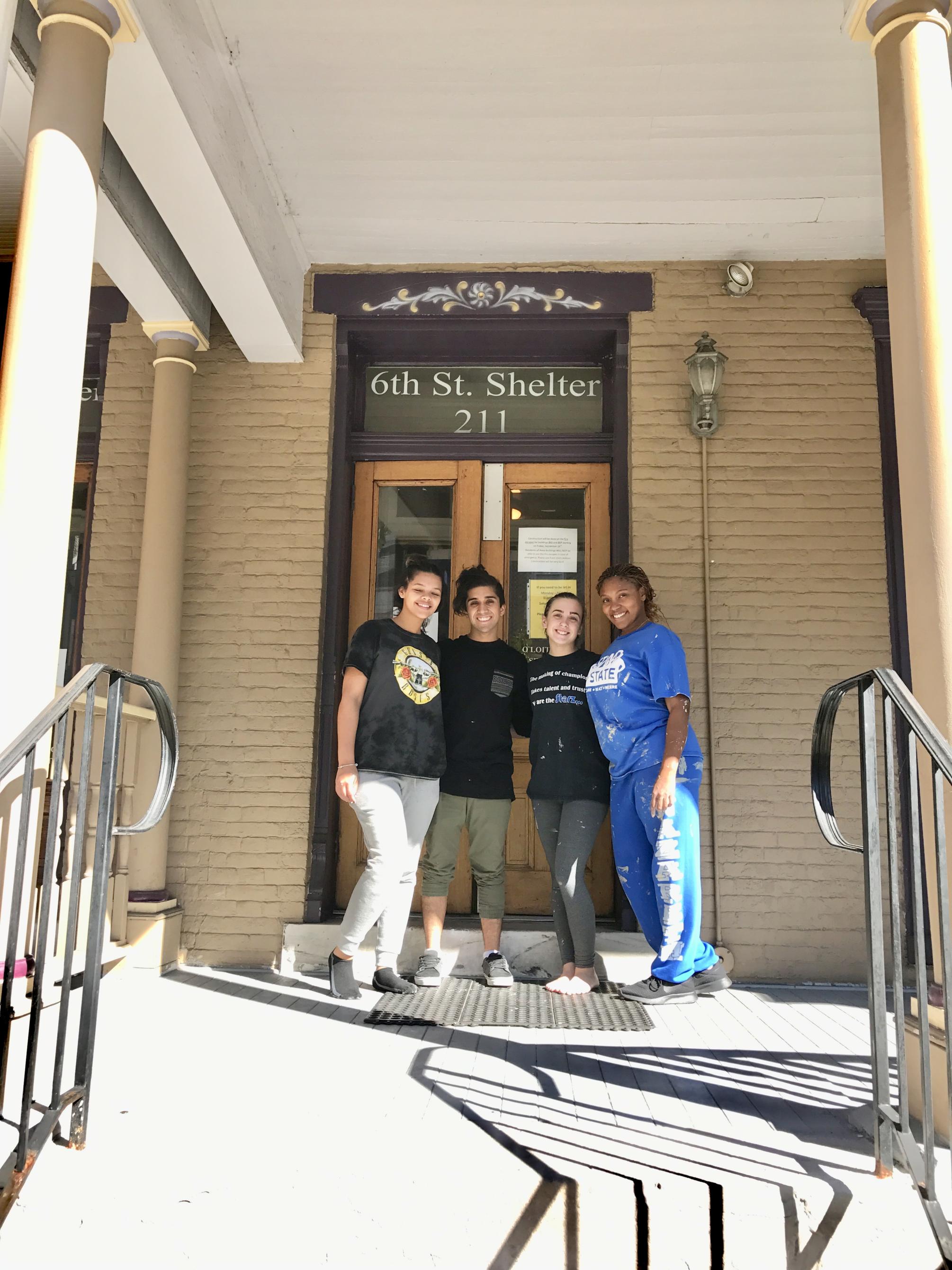 volunteers outside of homeless shelter