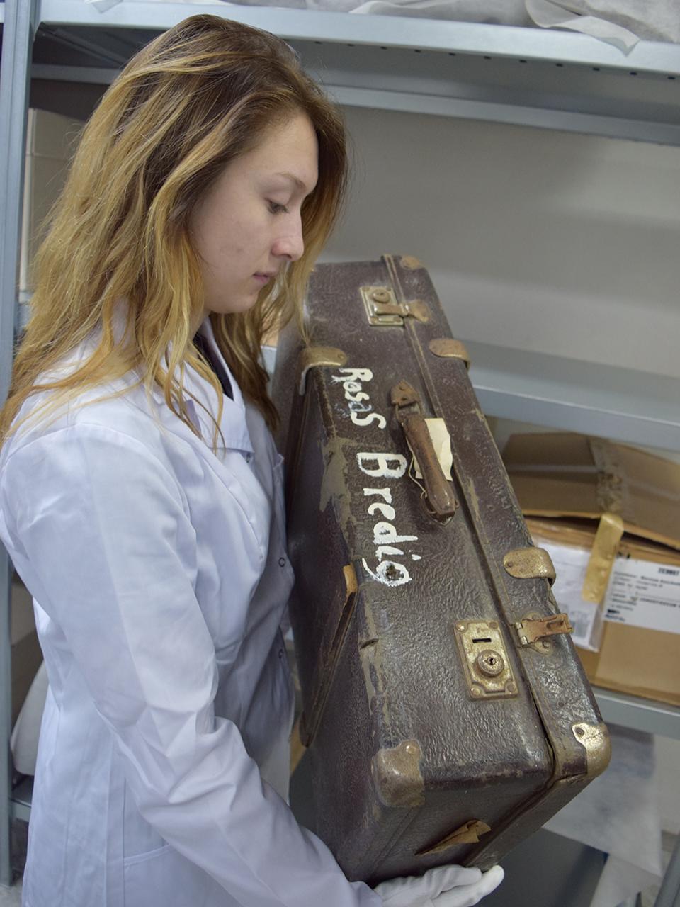 student with suitcase