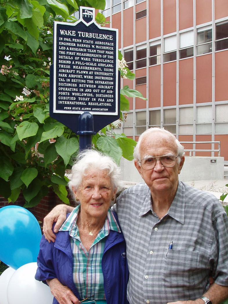 Barney McCormick and his wife, Emily, in front of the wake turbulence historical marker, erected to commemorate the first measurements of the details of wake turbulence behind a full-scale airplane.