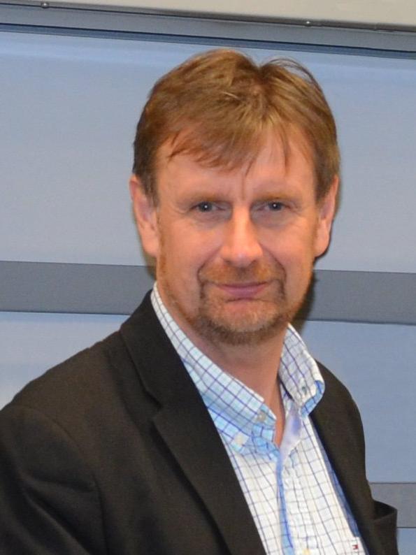 Image of man in a collared shirt and a black jacket