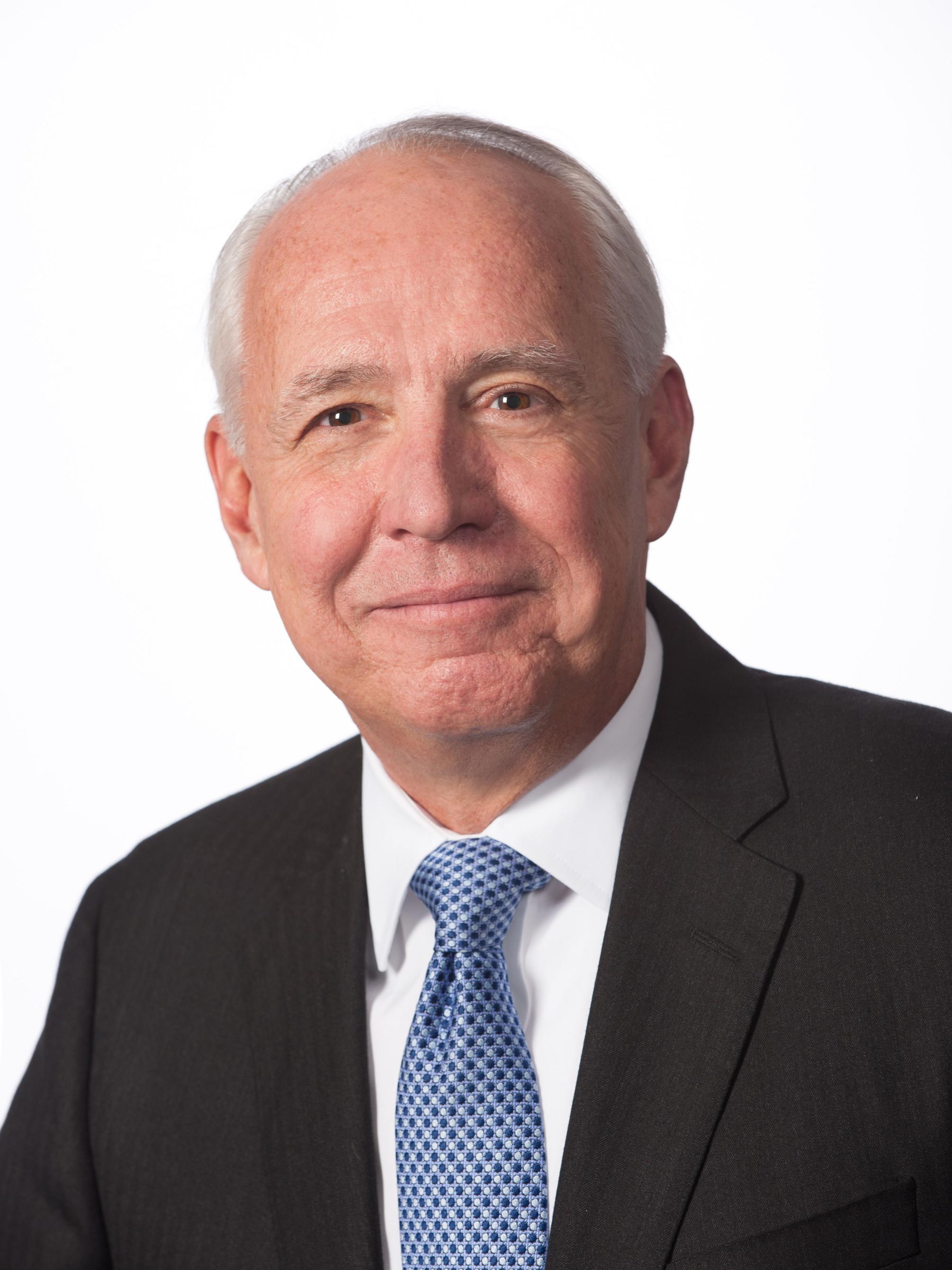 A photo of Dr. Darrell G. Kirch wearing a suit.