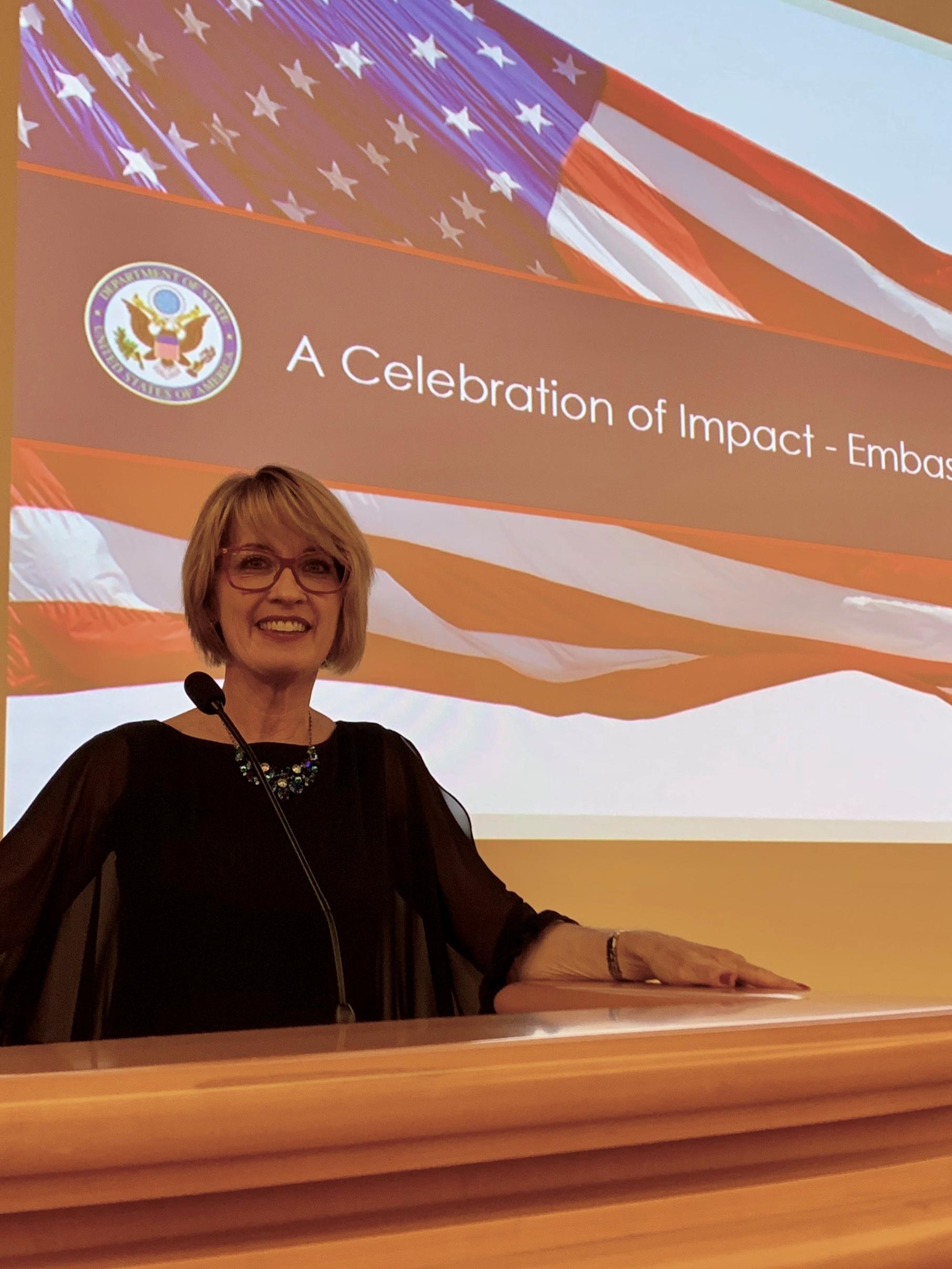 woman speaking at podium