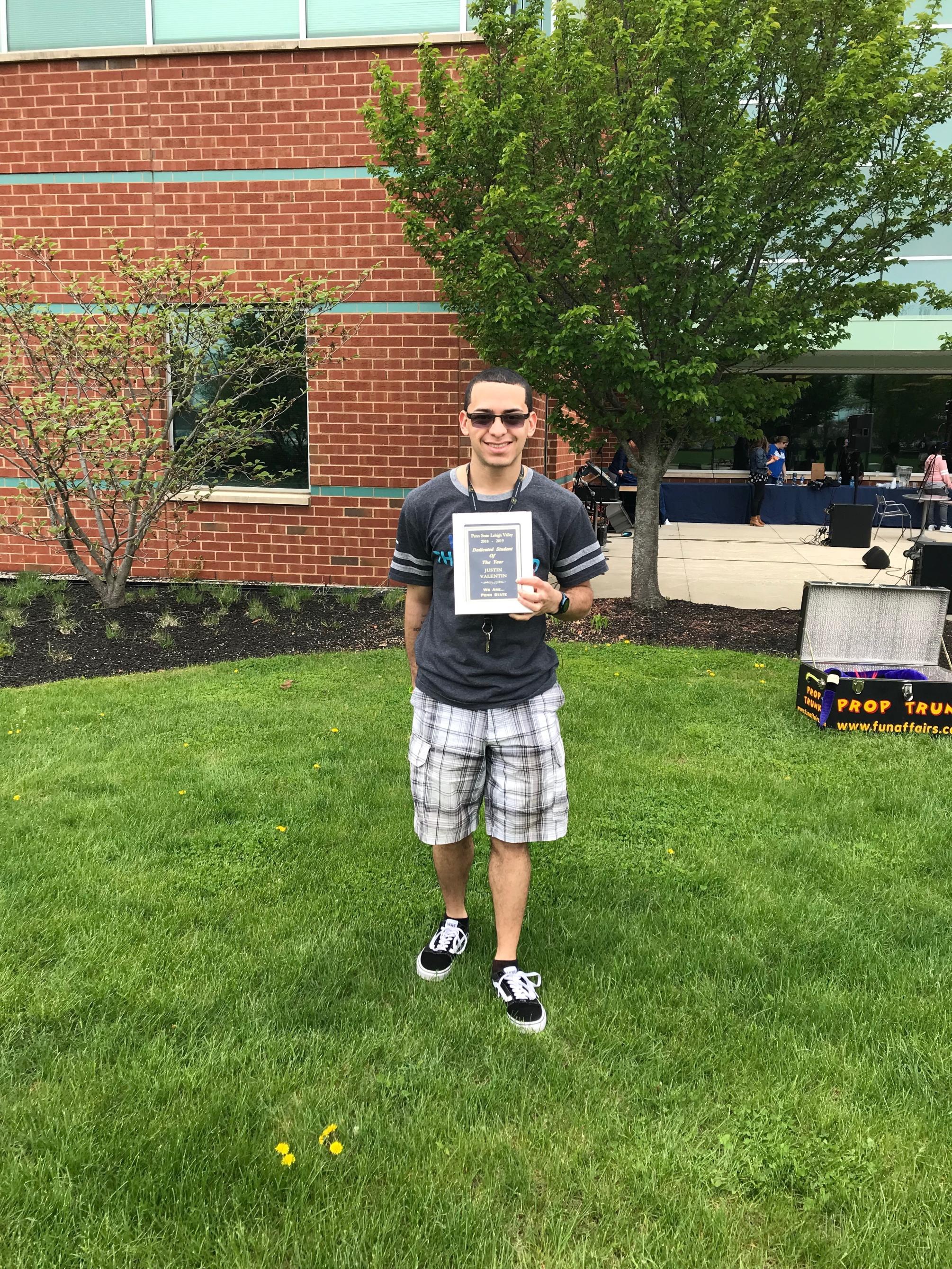 male student with award