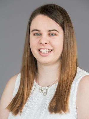 An engineering student smiles for a headshot