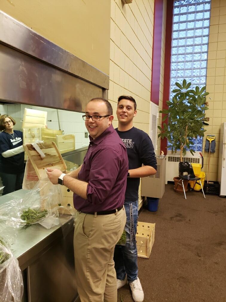 Employees packing food into bags