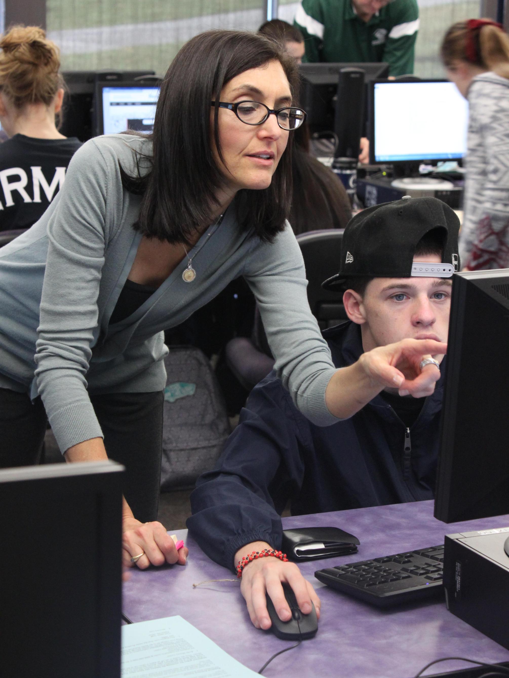 Dr. Grobman helping a student