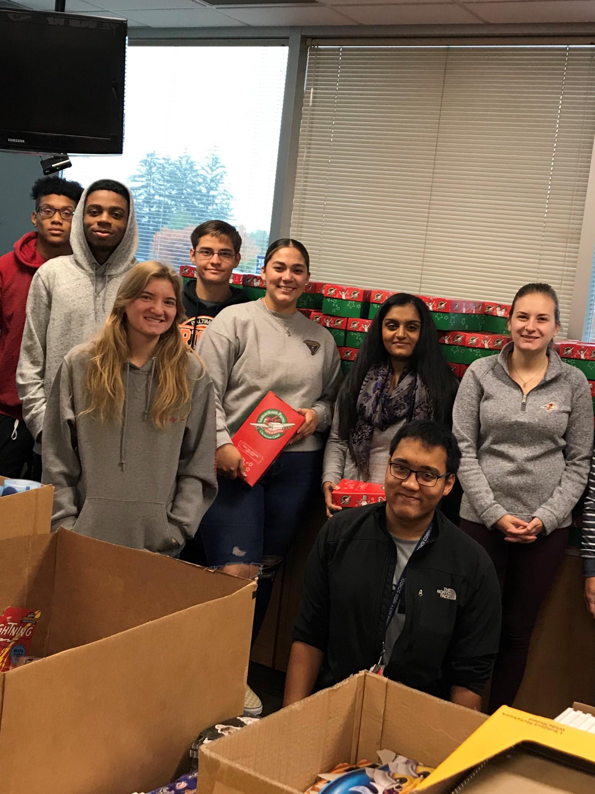 group of students near boxes