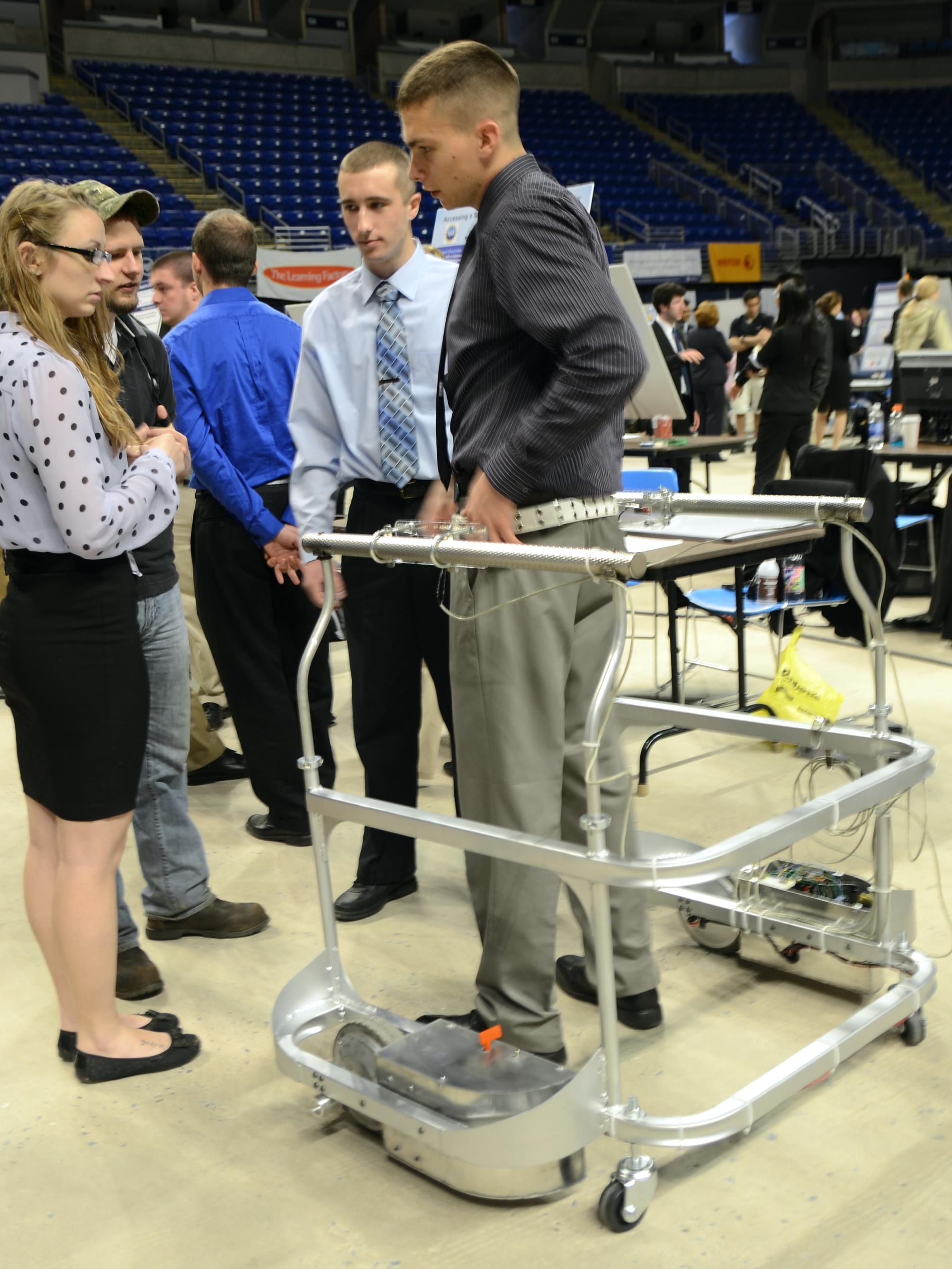 Student demonstrates parallel bar design for rehabilitation