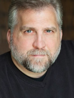 headshot of man with beard