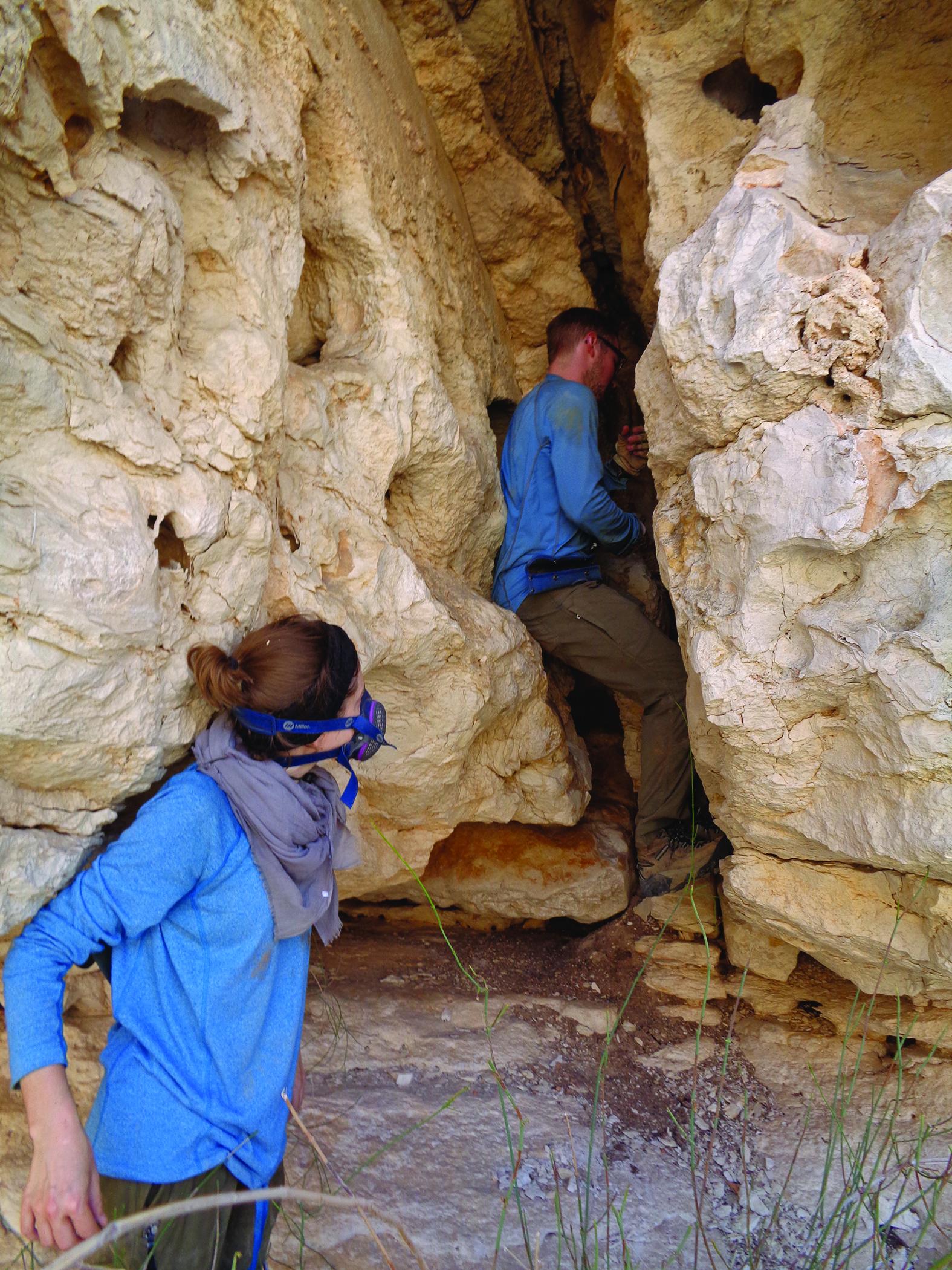 Sarah Ivory and Troy Ferland dig for middens in Oman