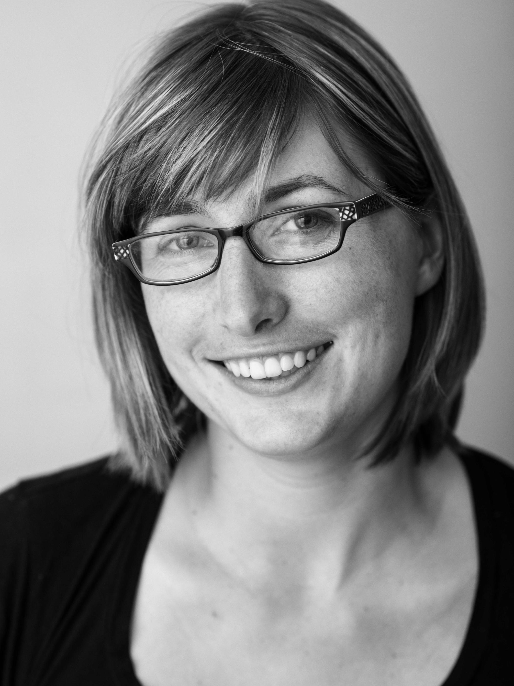 Black and white headshot image of Sarah Mirk