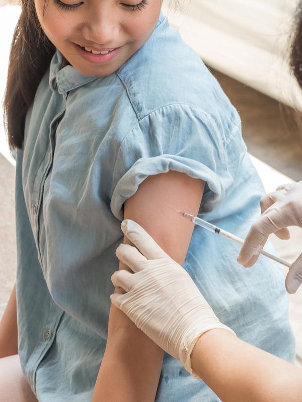 Young teenage girl getting the HPV vaccine.