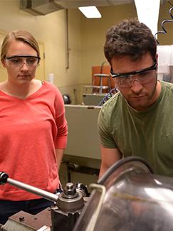 Georgia Konzel and Joe Roberto work together in the Learning Factory to develop a new solution 