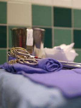 Surgical scissors on an operating room table 
