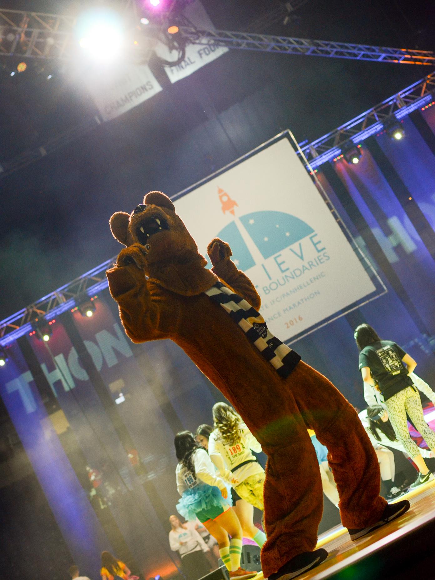 The Nittany Lion mascot dances on the Bryce Jordan Center stage